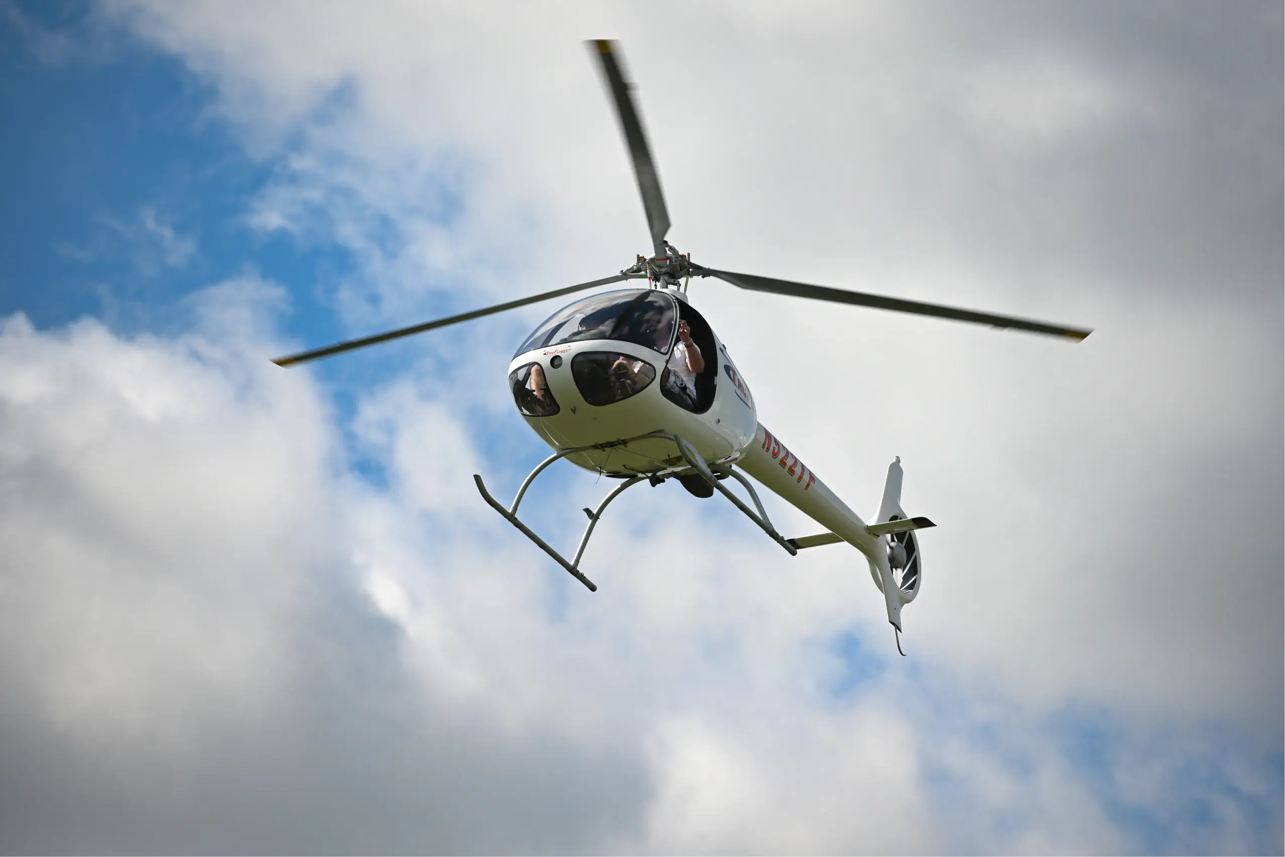 Bottom view of TruFlight helicopter flying