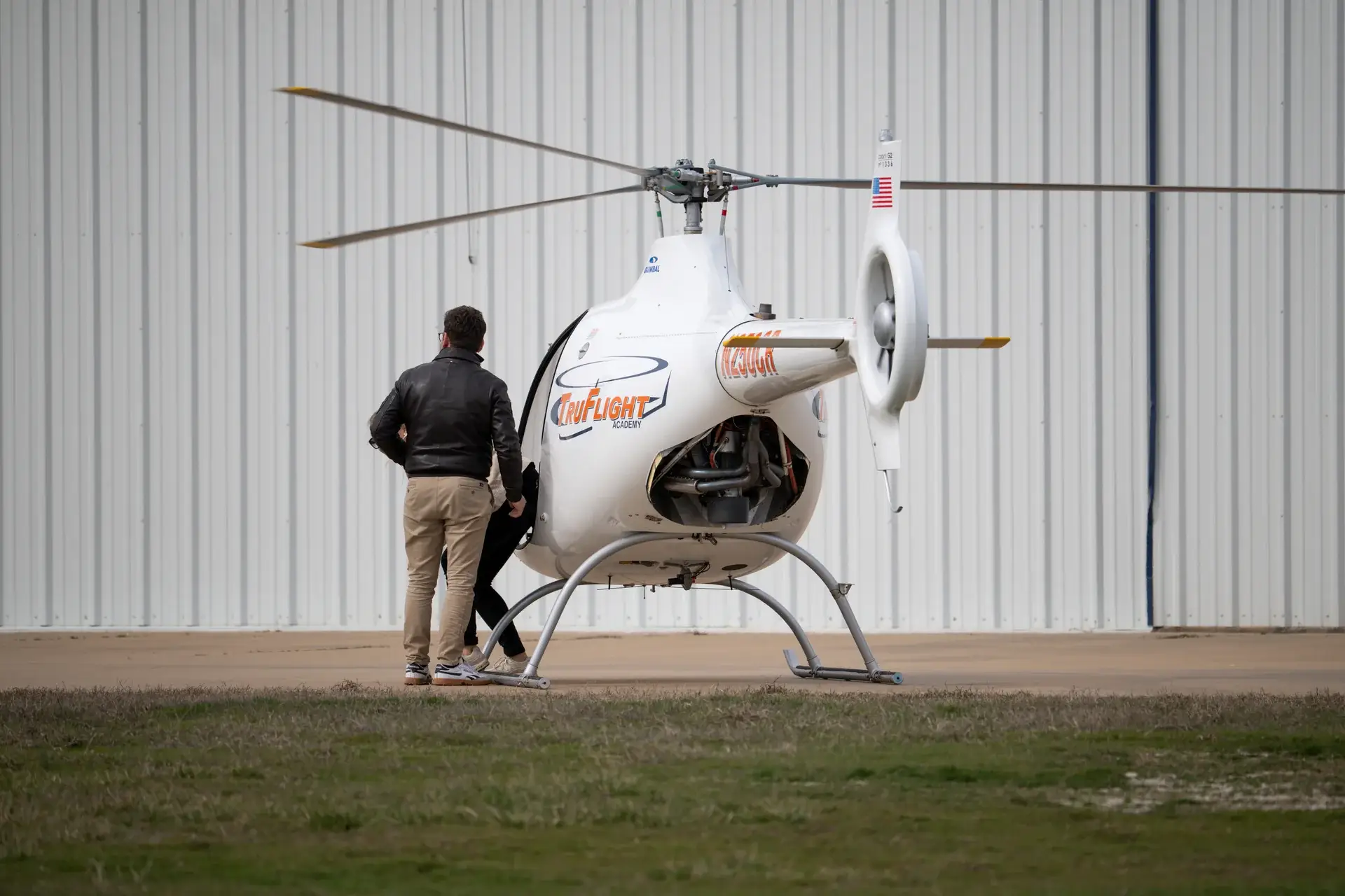 Helicopter parked in front of the TruFix Maintenance hangar