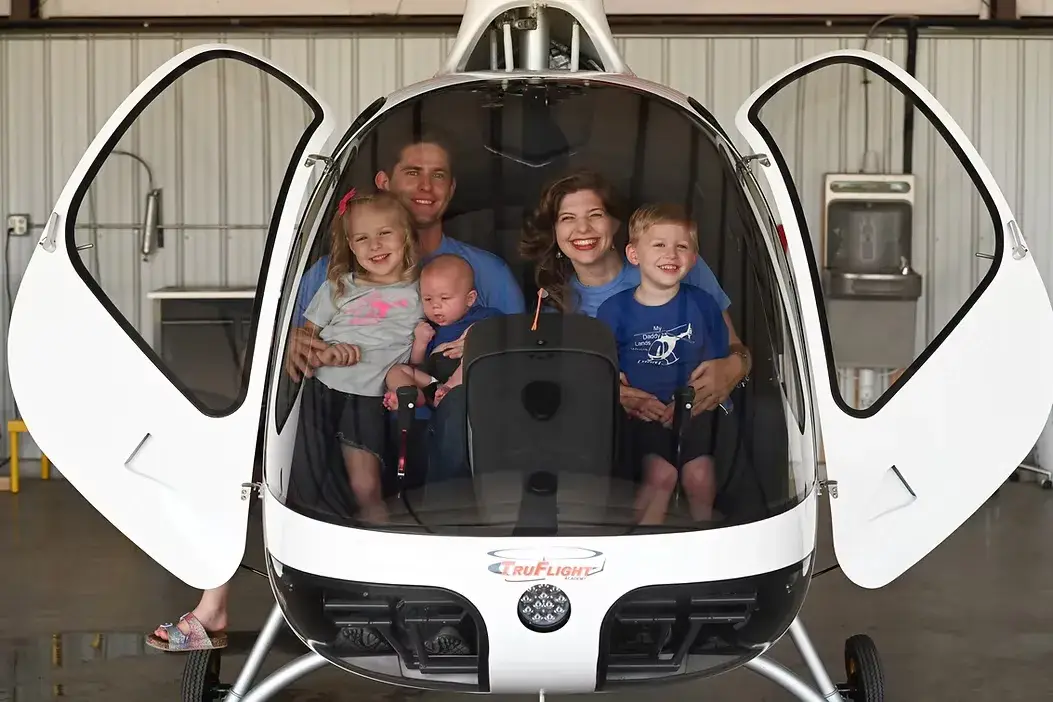 The Guison family inside a helicopter