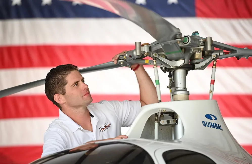 TruFlight Academy pilot inspecting a helicopter before flight